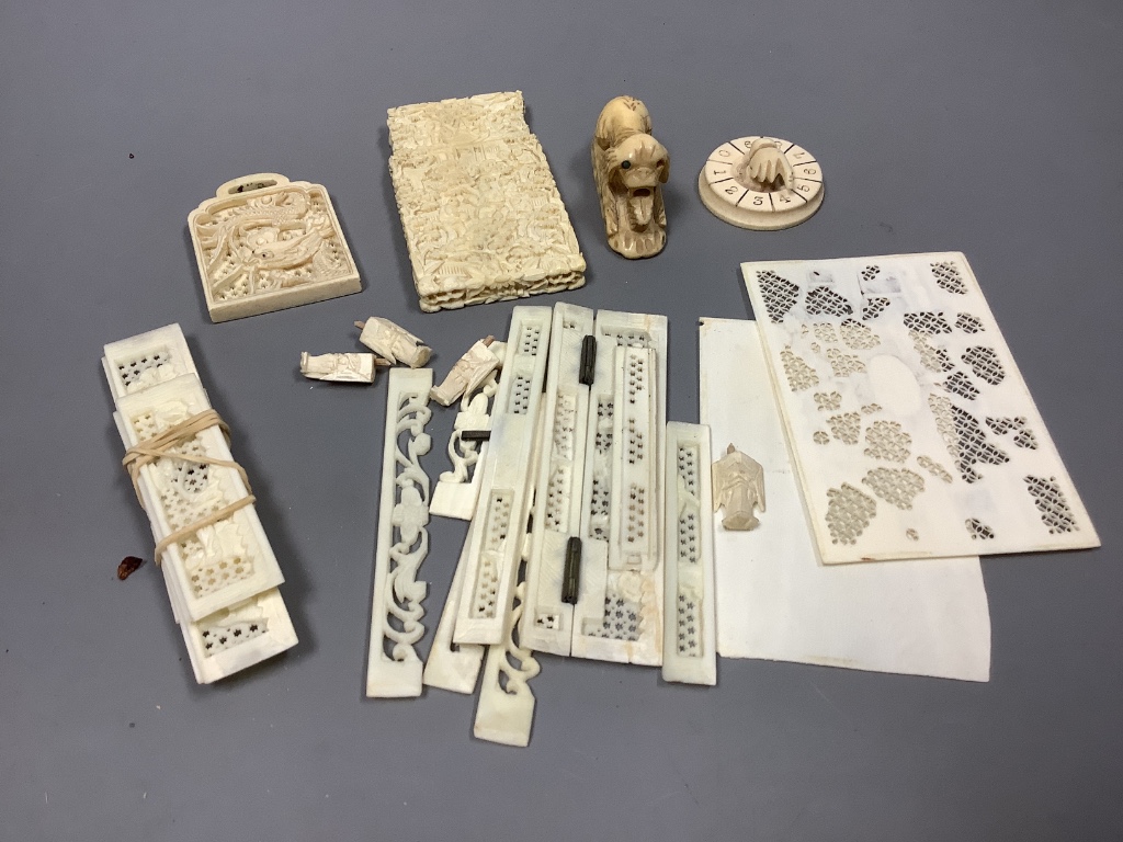 A Canton carved ivory card case (a.f.) and other ivory carvings, 19th/ early 20th century